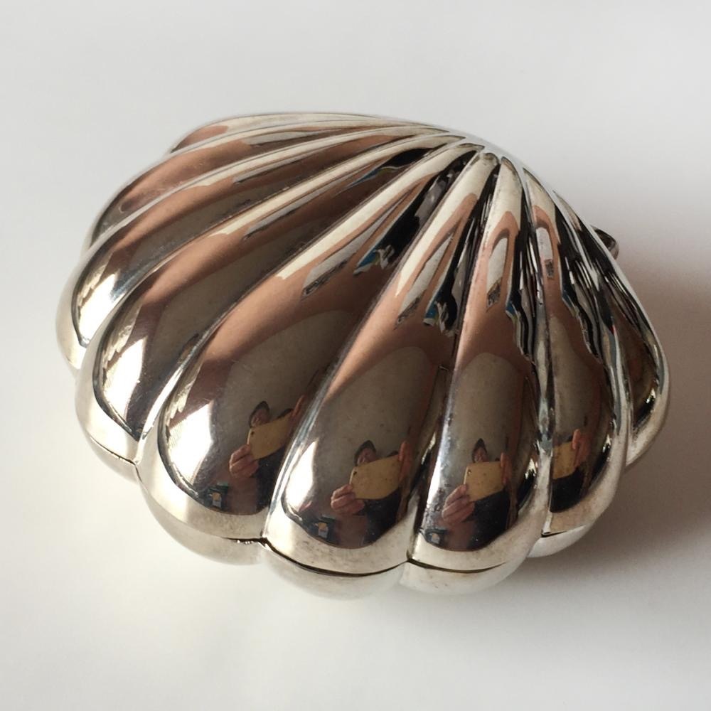 Vintage silver tone shiny finish shell shape jewelry box with red velvet inside